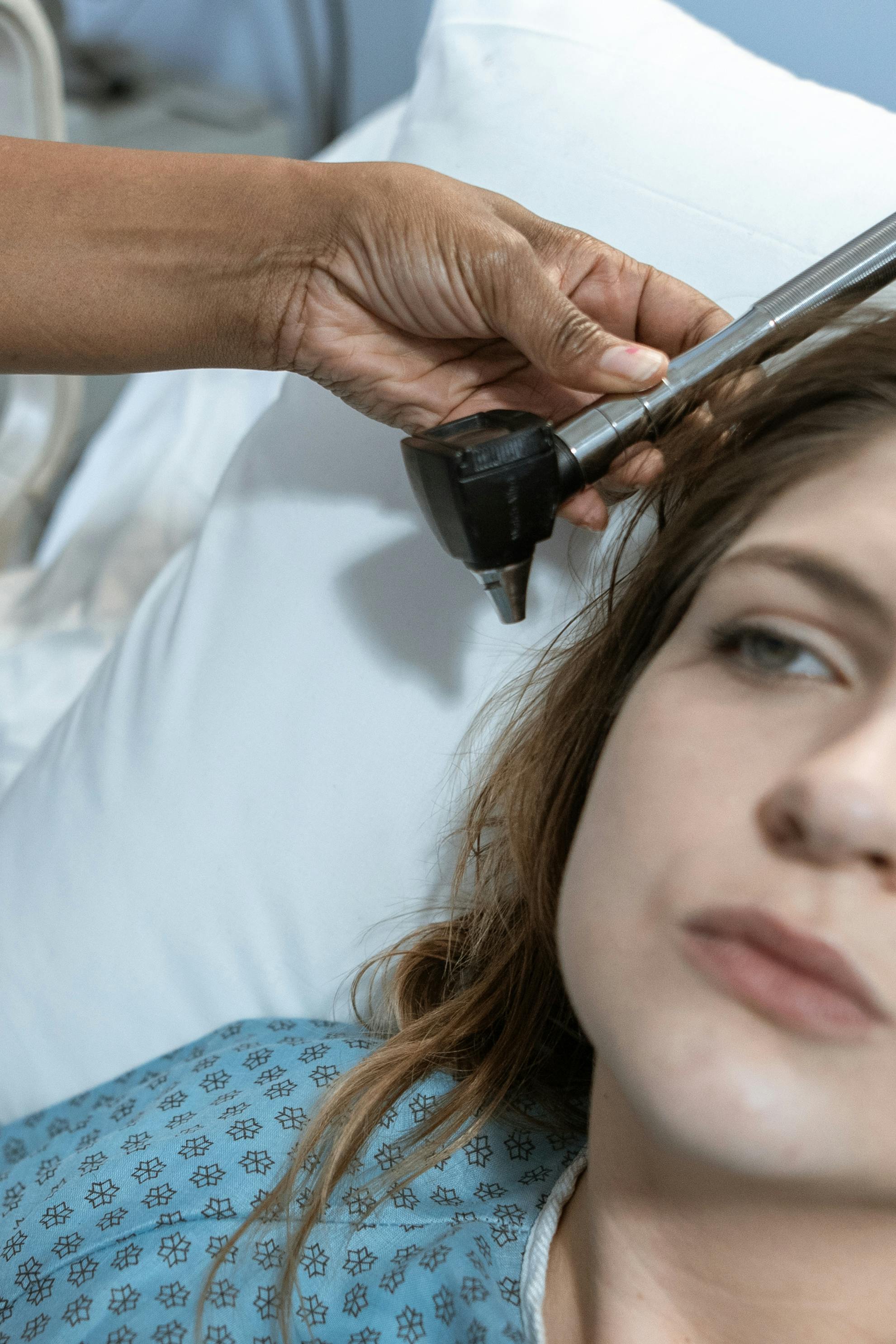 Child receiving hearing test in medical setting